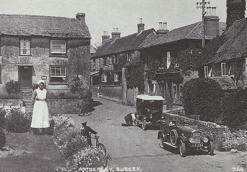 Historic vehicles in period postcards